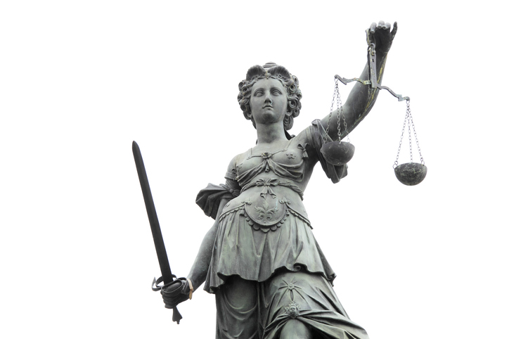 Lady Justice against white sky