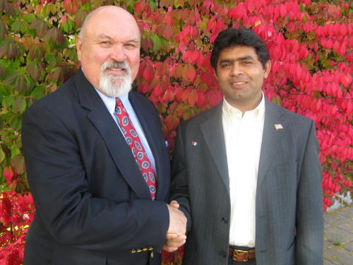 Greenwich social worker Nick Edwards, left, with client Abid Rajput. Photo courtesy of Greenwich Citizen.