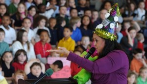 Deshazor-King talks to students while wearing a hat adorned with her favorite snack -- powdered donuts. Photo courtesy of the Evansville Courier Press.