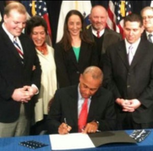 Massachusetts Gov. Deval Patrick signed the social worker safety legislation into law on Feb. 15. Photo courtesy of YourArlington.com.
