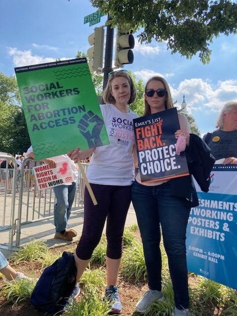 NASW North Carolina Chapter Executive Director Valerie Arendt (left) and NASW Arizona Chapter Executive Director Brandie Reiner protest at the U.S. Supreme Court after Roe v. Wade reversal was announced.